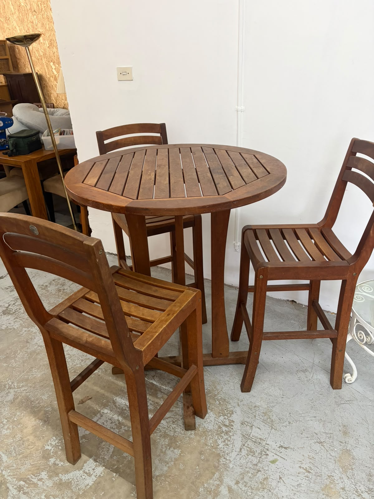 Outside tall table and bar stools